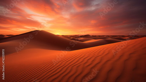 A quiet desert during sunset, portraying a tranquil and serene scene with the warm hues of the setting sun casting a peaceful glow over the landscape. © sema_srinouljan