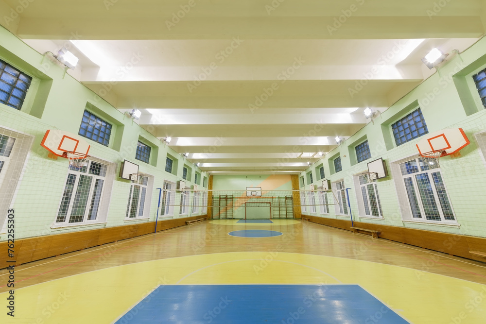 Wide-angle view of interior elementary school gym, large and bright Wide-angle view of interior elementary school gym, large and bright