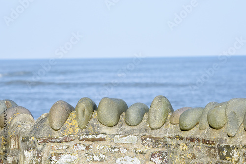 Stone sea wall with a clear view out over the ocean