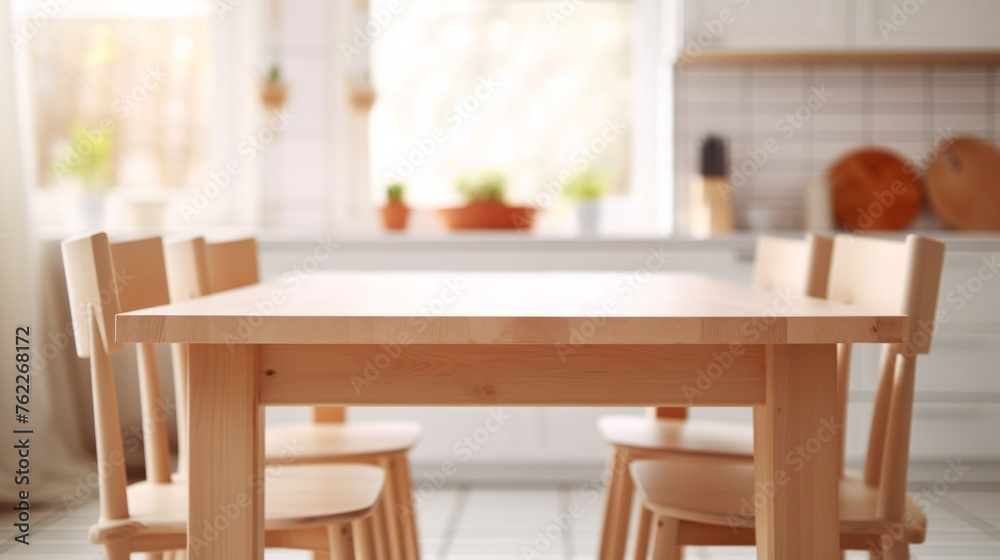Kitchen wooden table and chairs on blurry background. Empty wooden table and chairs in the kitchen.