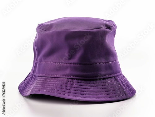 A vibrant purple bucket hat isolated on a white backdrop, emphasizing simplicity and fashion accessory.