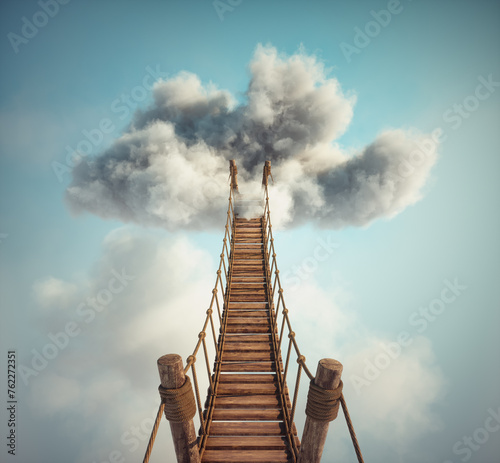 Surreal image of a rope bridge to a cloud. The concept of adventure or getaway.