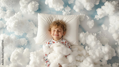 happy smiling little boy child in pajamas sleeping on white clouds in the sky, top view. healthy pleasant children's sleephappy smiling little boy child in pajamas sleeping on white clouds in the sky