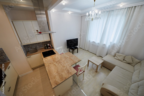 Interior of modern kitchen and lounge room.