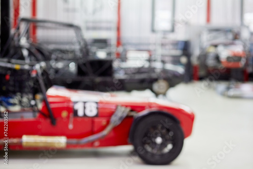 (PR) Sports racing cars in garage box of DB 527 company producer of russian sports cars, out of focus.