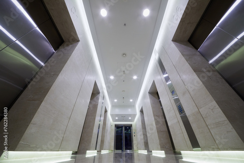 Corridor with elevators doors on both sides in City Tower of international business complex.