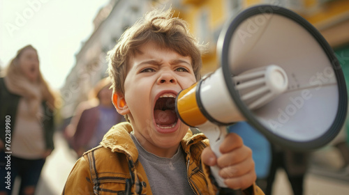 boy screaming into a bullhorn, emotionally angry, speaker at a rally at a meeting, on the street, people blurred from behind