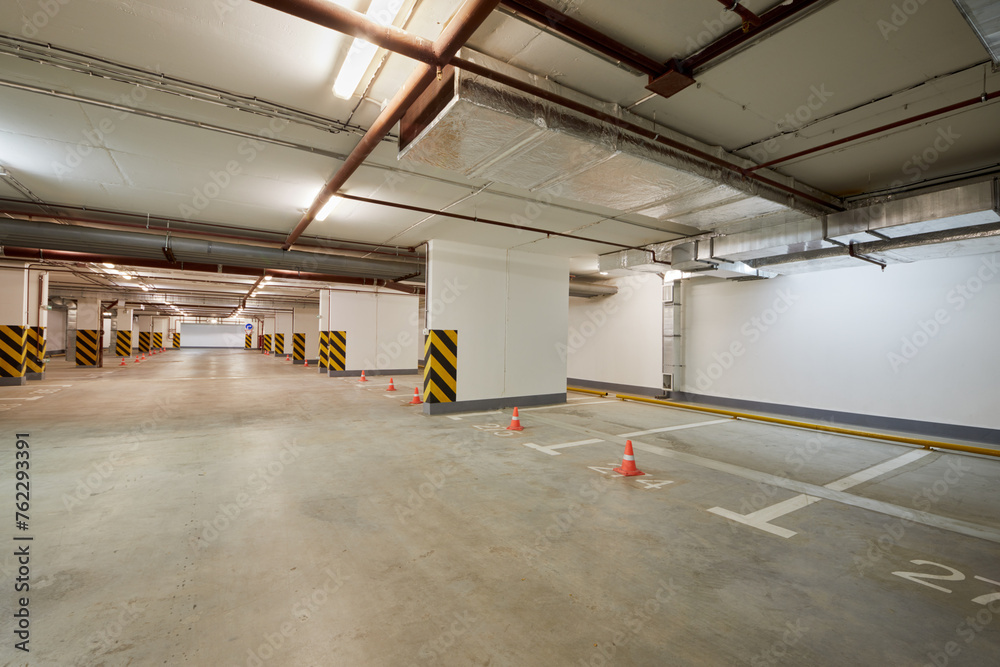 Empty indoor underground parking space.