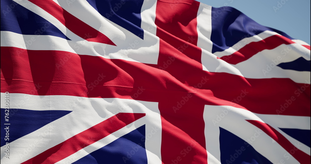 United Kingdom waving flag. UK British National closeup. Empire Banner Flaping in Wind United Kingdom waving flag. UK British National closeup. Empire Banner Flaping in Wind