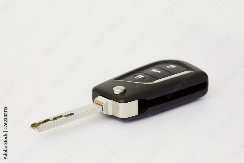 Car key with remote control on white background, shallow dof. Car key with remote control on white background, shallow dof.