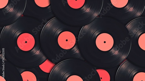 Black vinyl records with red labels. The records are stacked on top of each other.