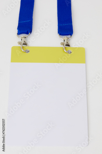 Empty ID card on blue belt on white background. photo