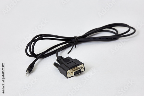RS-232 mini-jack cable on white background.