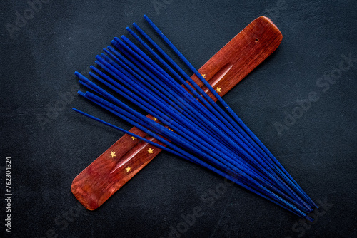 incense sticks for fresh air on dark background top view mock up photo