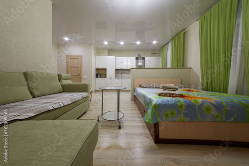 Modern flat divided into kitchen and living zones in hotel Apartments on Bauman. Apartments located near Kazan Kremlin and Kul Sharif Mosque.