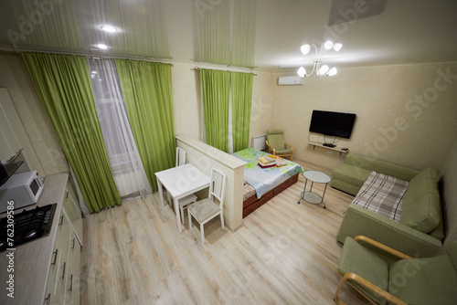 Modern lodging divided into kitchen and living zones in hotel Apartments on Bauman. Apartments located near Kazan Kremlin and Kul Sharif Mosque.