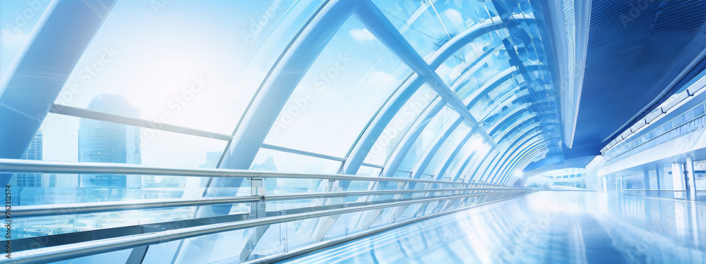 Fototapeta premium Futuristic glass tunnel with blue light reflections and a bright cityscape in the distance.