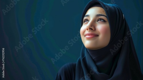 Happy arab asian muslim woman in hijab clothes isolated on blue-black background. copy space