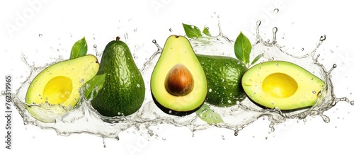 Four ripe avocados are depicted splashing in water on a clean white background. This image showcases the natural beauty of this staple food ingredient