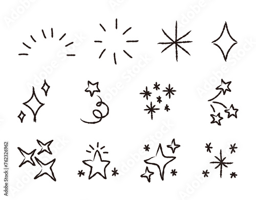 Set of hand drawn light, star and sparkle effect drawing illustrations in cartoon and doodle style.