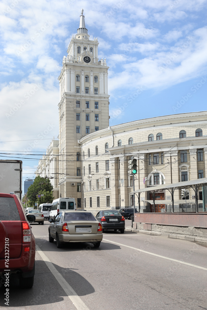 Cars move on street near Management building of South-Caucasian Railway in Voronezh, Russia