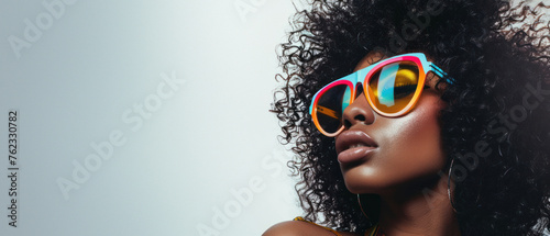 An exquisite image of a woman showcasing vibrantly colored sunglasses embodying modern fashion and whimsy