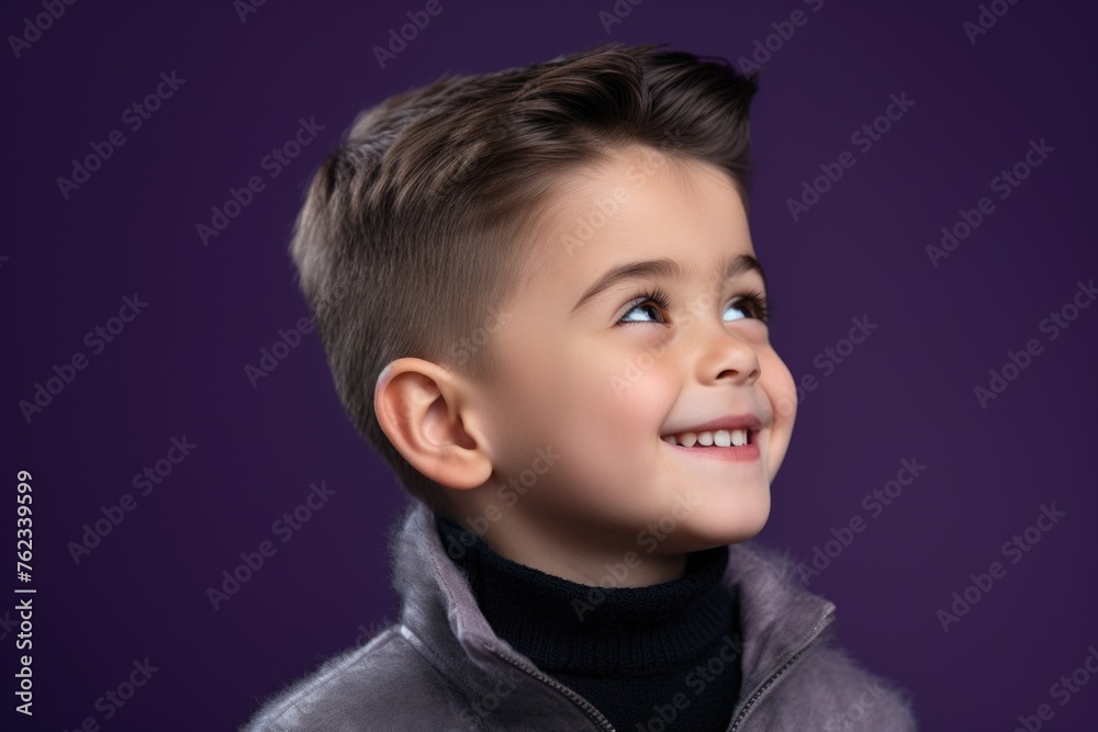 A young boy with a smile wearing a jacket. Suitable for lifestyle and children's fashion concepts A young boy with a smile wearing a jacket. Suitable for lifestyle and children's fashion concepts
