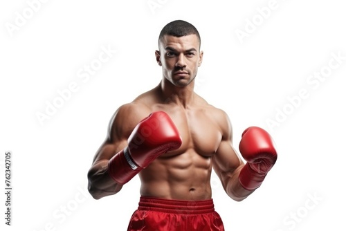 A man wearing boxing gloves posing for a picture. Suitable for sports and fitness concepts