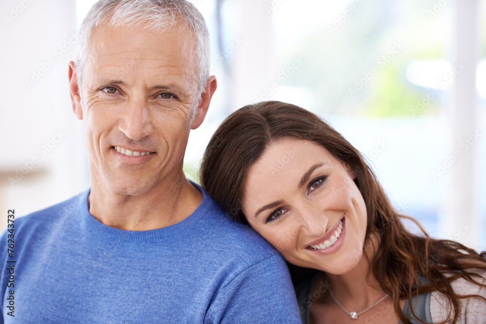 Happy, couple, and face with smile in portrait, love with unique relationship and support for trust at home. Senior man, young woman and marriage, commitment and loyalty with pride together. Happy, couple, and face with smile in portrait, love with unique relationship and support for trust at home. Senior man, young woman and marriage, commitment and loyalty with pride together.