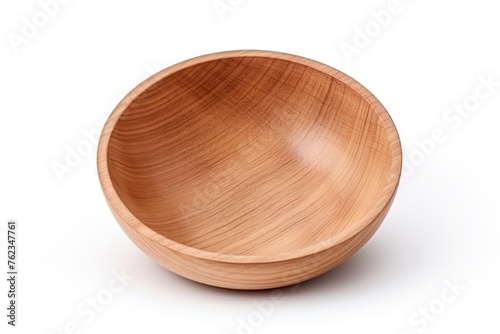 A simple wooden bowl placed on a white surface. Suitable for kitchen and food-related designs