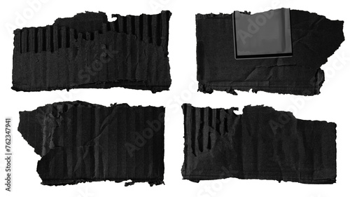 set of scraps of black cardboard of different sizes and shapes on a blank background
