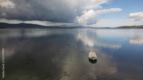 A small boat at beach of Urla, izmir. beautiful clouds