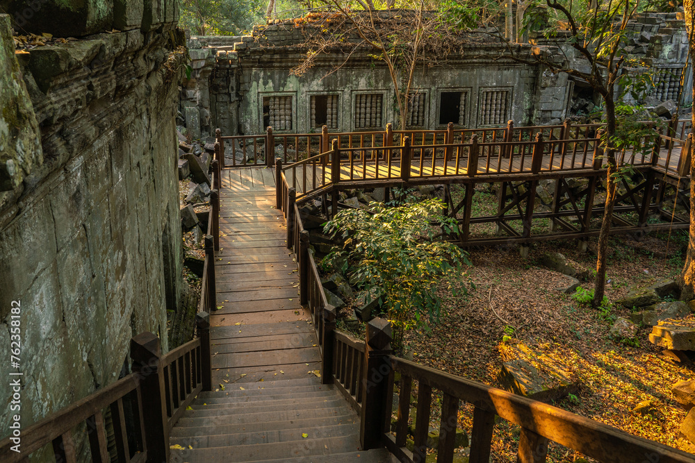 Fototapeta premium The hidden beauty of ancient temple ruins in the middle of jungle forest temple of Beng Mealea temple, Siem Reap, Cambodia.