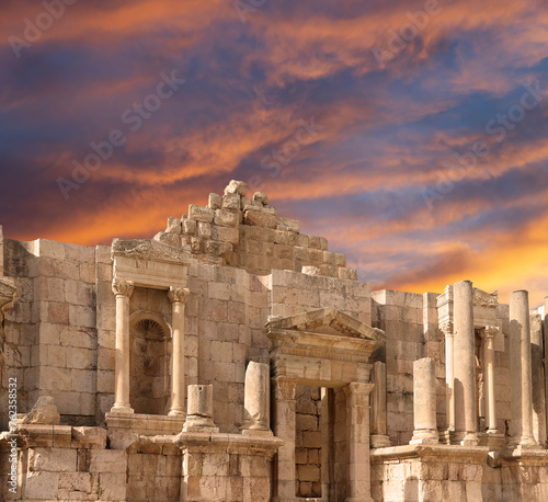 Roman ruins (against the background of a beautiful sky with clouds) in the Jordanian city of Jerash (Gerasa of Antiquity), capital and largest city of Jerash Governorate, Jordan #762358532