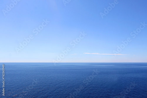 Bright blue sea and clear sky. Copy space.