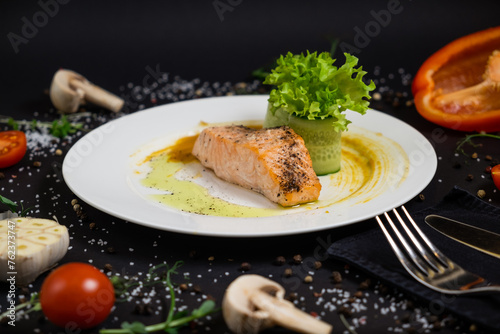 Fototapeta Naklejka Na Ścianę i Meble -  salmon in honey-soy glaze and fresh vegetable close-up on a plate. horizontal view from above