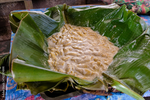 Delicious local delicacy of tama tama food in banana leaves and coconut milk for traditional welcome ceremony in Bougainville, Papua New Guinea