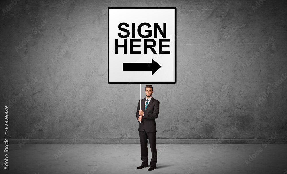 business person holding a traffic sign business person holding a traffic sign