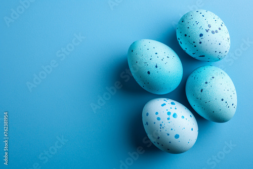 Easter. Blue Easter egg frame on blue background. Spring and Easter holiday concept. Easter eggs painted on a blue background