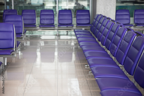 purple seats in airport lounge © Irina