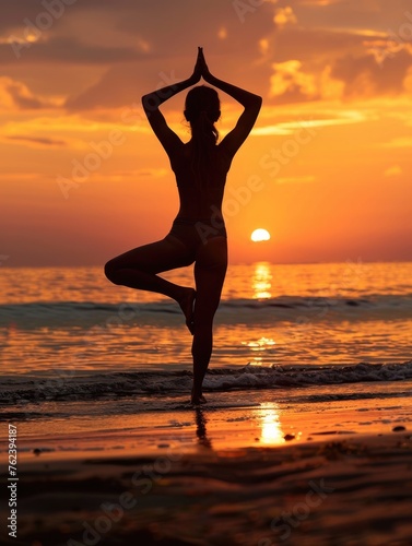 A woman s silhouette against a captivating sunset  practicing yoga on the beach  symbolizing peace and harmony with nature.