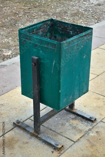 green metal trash garbage can
