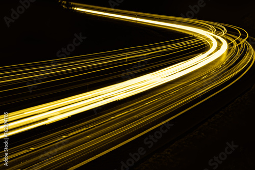 yellow car lights at night. long exposure