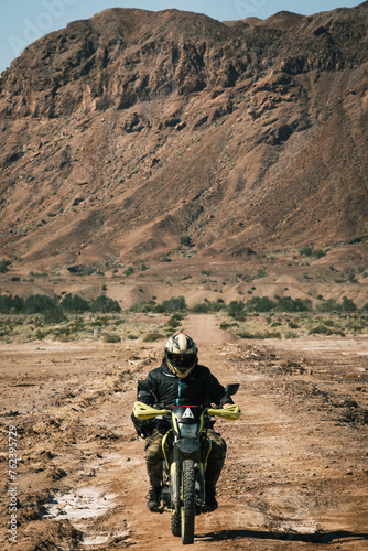 motorcycle adventure rider in mountains off road landscape 