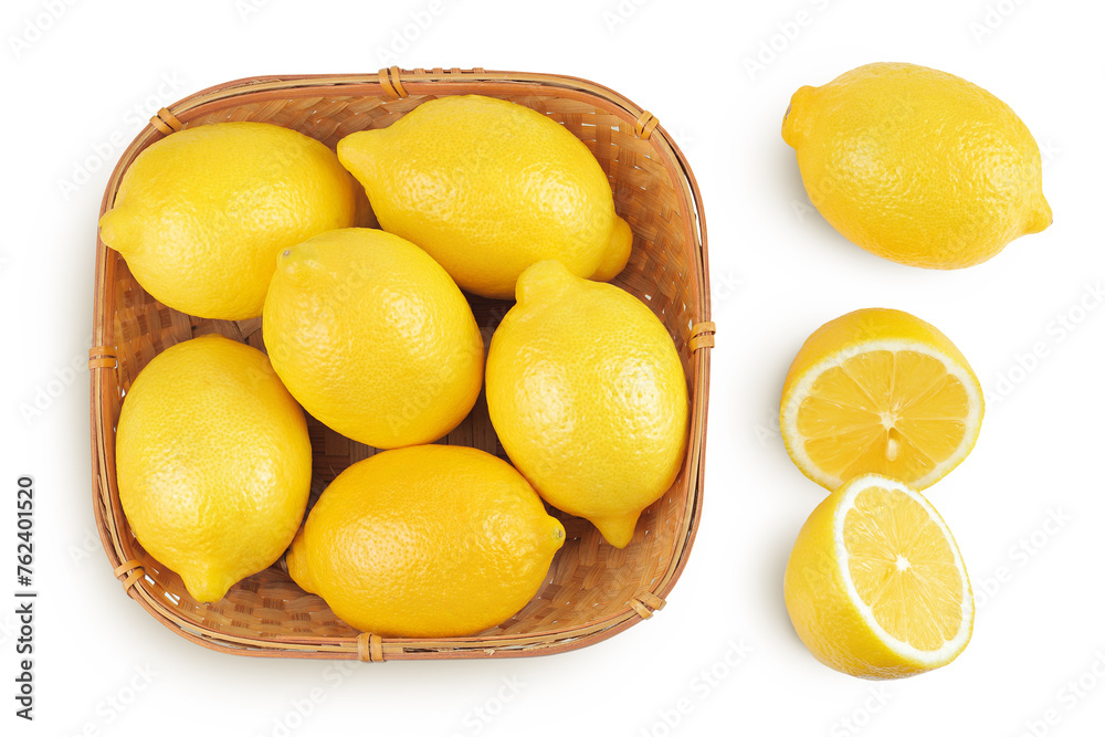 Ripe lemons in wicker basket isolated on white background. Top view. Flat lay.