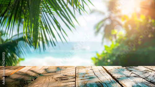 Amazing beach view cosmetics or product background. Beautiful sea, sand, palms and wooden background. Golden sand beach with blue ocean and cloudscape and sunshine in the back. Free product place