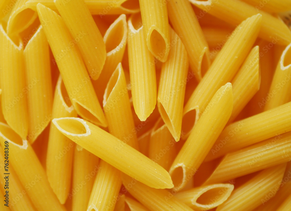 Penne pasta texture. Italian cuisine. Food background. Penne pasta texture. Italian cuisine. Food background.