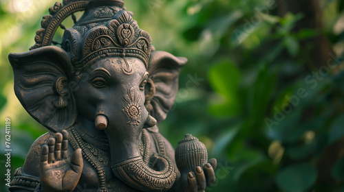 Ganesha statue in a lush green setting, symbolizing peace and spirituality