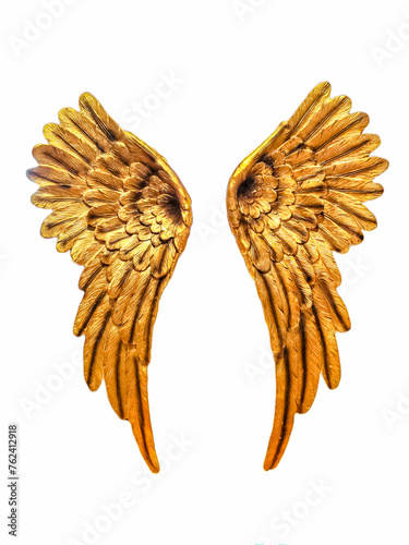 Golden Angel wings on a white background for protection and happiness.