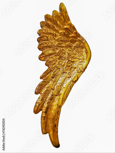 Golden Angel wing on a white background for protection and happiness.
